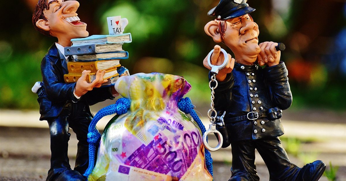 Handcuffs resting on money