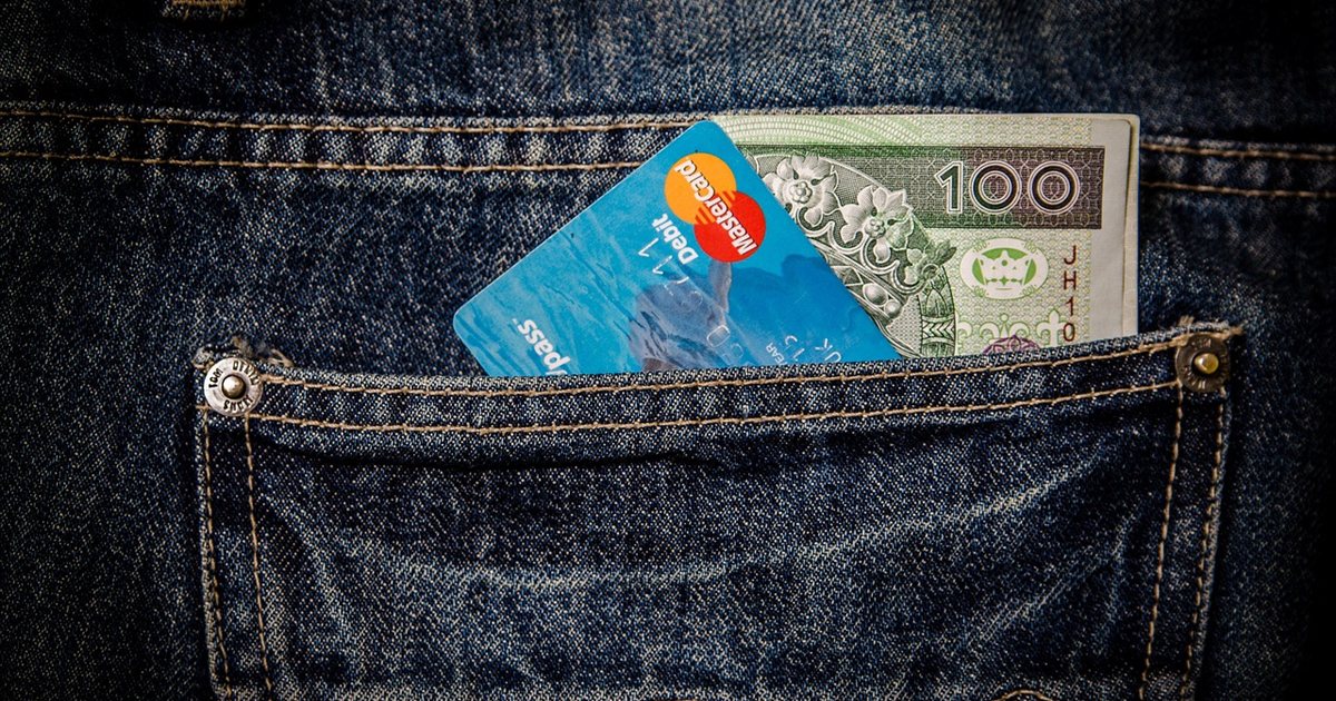 A fan of credit cards on a dark surface